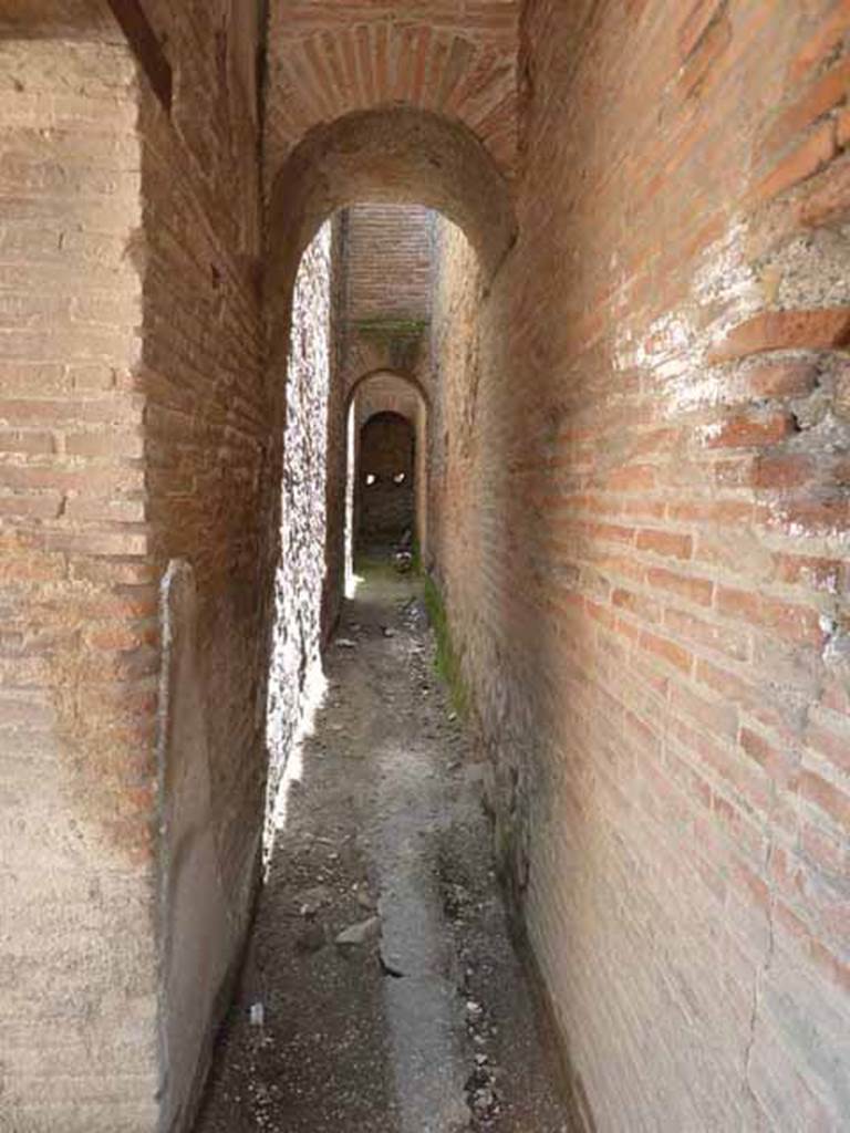 VIII.2.9 Pompeii. May 2010. Passageway, looking south. This may also have served as a fire break to protect the archives in the Tabularium VIII.2.8.