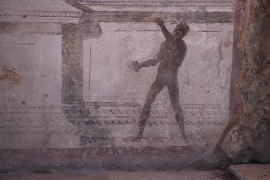 VIII.2.23 Pompeii. October 2022. 
Detail of painted figure on the zoccolo/dado at the west end of the south wall. Photo courtesy of Klaus Heese.
