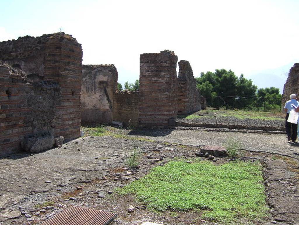 VIII.2.30 Pompeii. September 2005. South-east corner of atrium, with doorway to ala, centre left.
A blocked doorway in the south wall of the ala would have led to a room on the east of the tablinum.
The tablinum can be seen on the right. 

