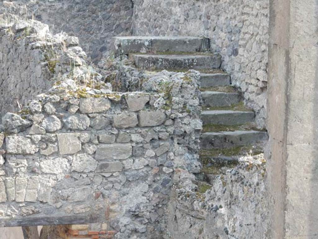 VIII.3.11 and VIII.3.10, Pompeii. May 2015. West wall of VIII.3.11, showing doorway (upper right centre) from stairs at VIII.3.10. Photo courtesy of Buzz Ferebee.
