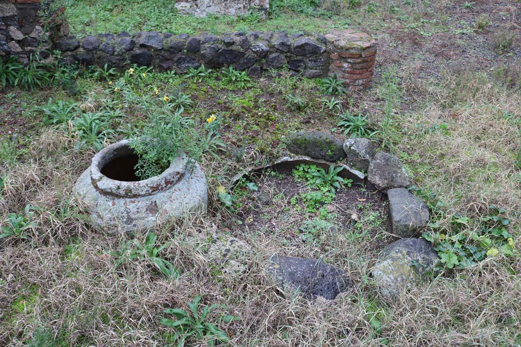 VIII.4.12, Pompeii. December 2018. 
Detail of items near south side of peristyle. Is this the masonry pool, as described by Jashemski. Photo courtesy of Aude Durand.
