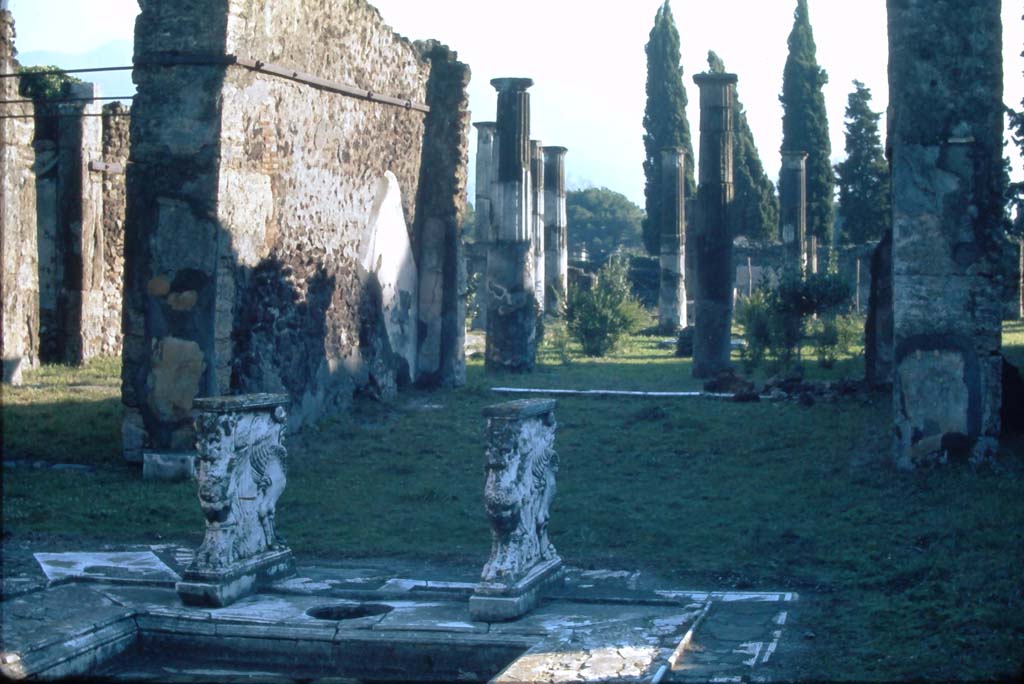 VIII.4.15 Pompeii. 4th December 1971. Looking south across impluvium in atrium towards east wall of tablinum. 
Photo courtesy of Rick Bauer, from Dr George Fay’s slides collection.

