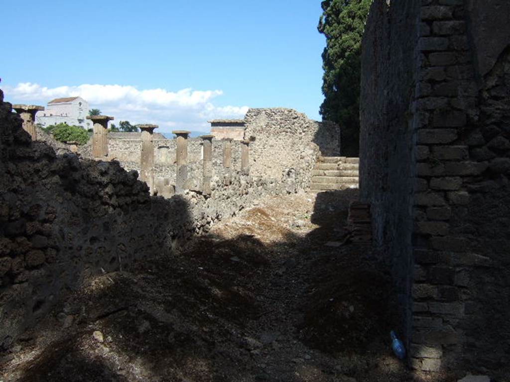 VIII.7.21 Pompeii. September 2005. Looking north-east along the side of the perfumed water tank at the rear of the Large Theatre.
