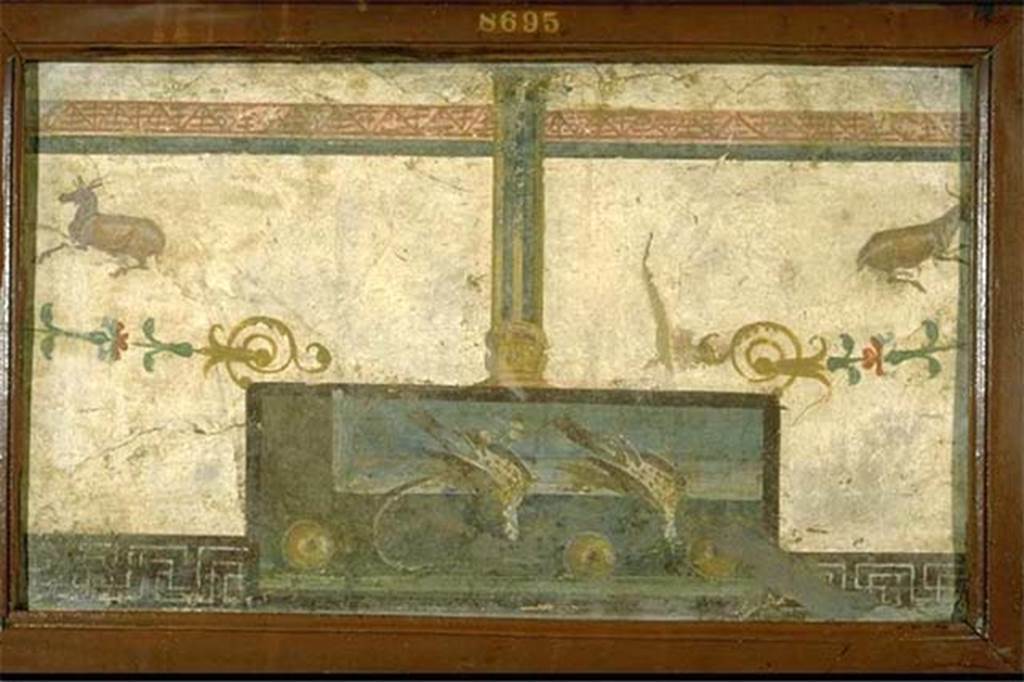 VIII.7.28 Pompeii. South part of east portico. Still life with two dead ducks and fruit, with a Delphic tripod and two deer.
Now in Naples Archaeological Museum. Inventory number 8695.
