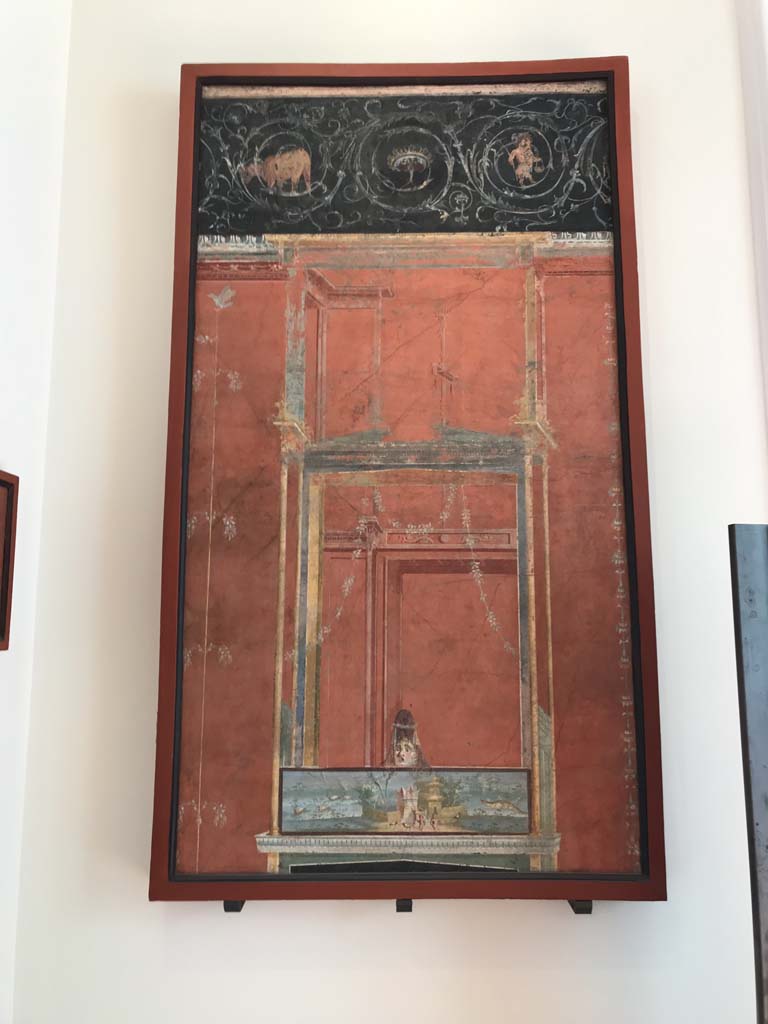 VIII.7.28 Pompeii. April 2019. From the left of the east wall of the portico. 
Architectural scene with Nilotic scene surmounted by a female theatrical mask and a frieze of scrolls. 
Now in Naples Archaeological Museum. Inventory number 8607.
Photo courtesy of Rick Bauer.
