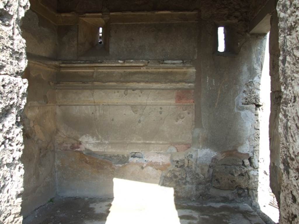 IX.2.17 Pompeii. March 2009. Room 2, cubiculum. Looking east. On the right is the doorway from the entrance fauces/corridor, which would have lead to the stairs to the upper floor.
