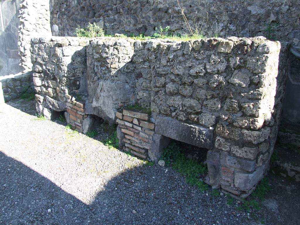IX.3.2 Pompeii. March 2009. Three masonry boilers against south wall of former atrium.