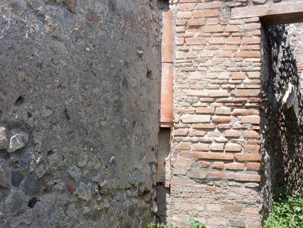 IX.3.17 Pompeii. May 2018. Downpipe on north wall of corridor. Photo courtesy of Buzz Ferebee.