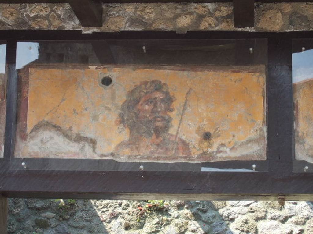 IX.7.1 Pompeii. May 2006.  Painting of a bearded Jupiter with his sceptre over his left shoulder.  See Fröhlich, T., 1991, Lararien und Fassadenbilder in den Vesuvstädten.  Mainz: von Zabern.  (F63: p.332).