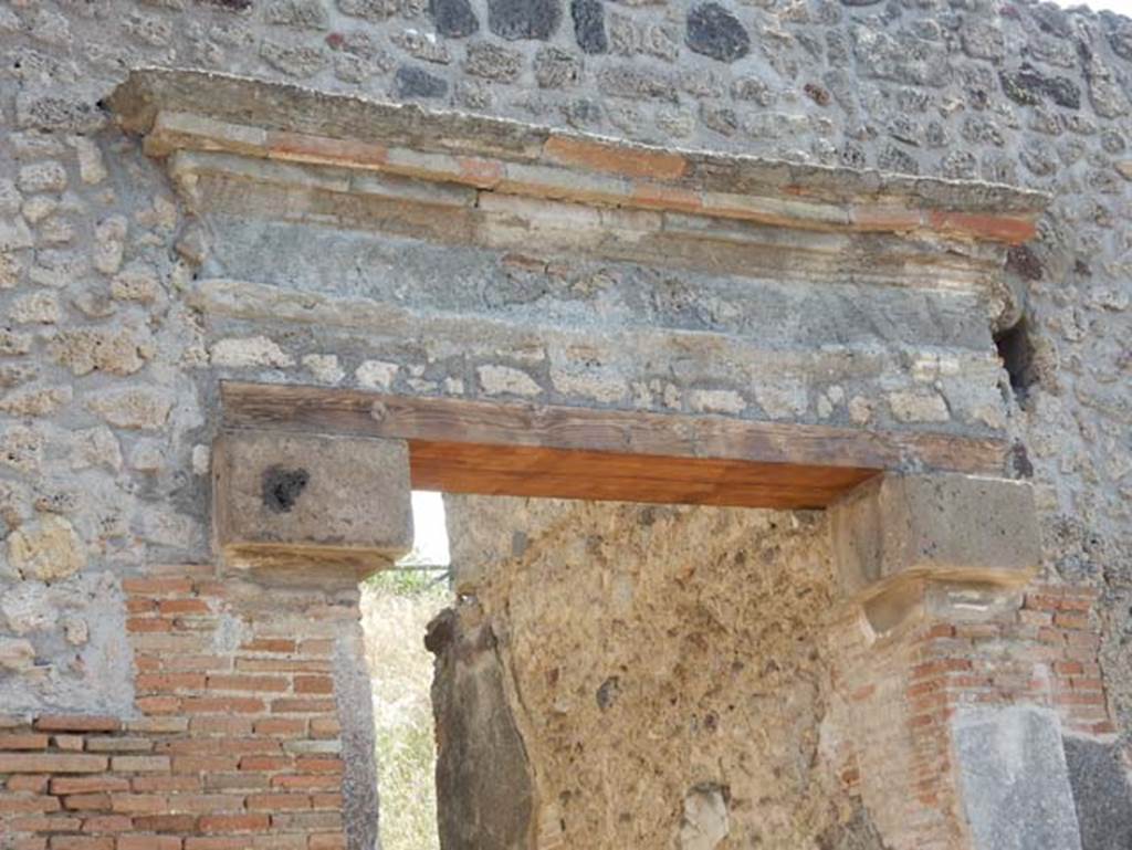 IX.7.16 Pompeii, May 2018. Detail of top of doorway after renovation. Photo courtesy of Buzz Ferebee.


