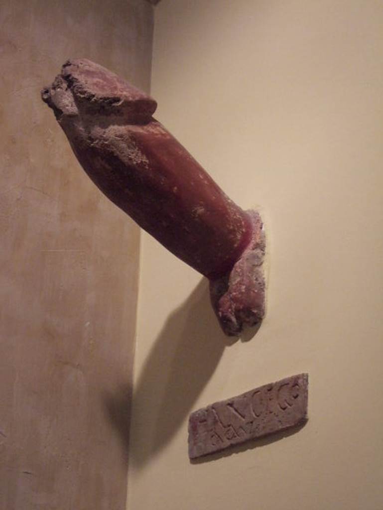 IX.8.6 Pompeii. Phallus. Now in Naples Archaeological Museum.  Inventory number 113415.
According to BdI, fixed into the external side of the east wall of the house was a very large tufa phallus, painted in red with the inscription 
HANC . EGO
      CACAVI
See Bulletino dellInstituto di corrispondenza archaeologica, 1882, p.115
