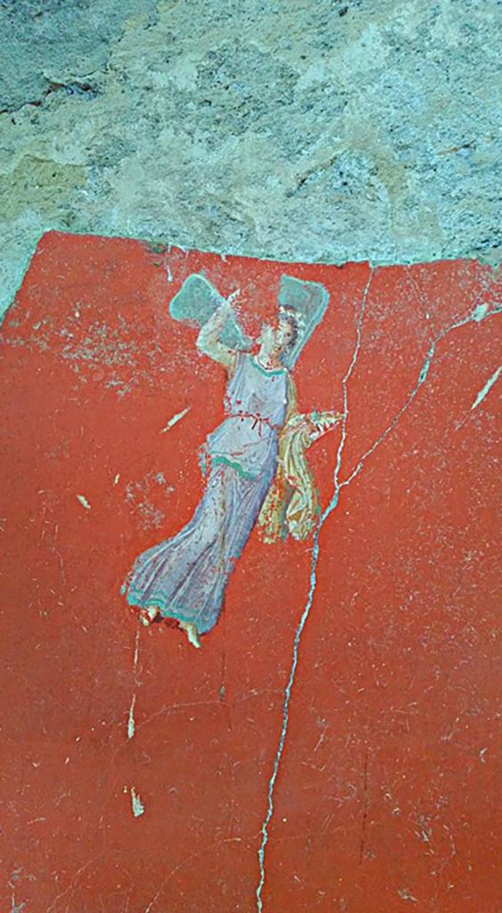 IX.12.6 Pompeii. 2016/2017. 
Room 3, painting of flying figure from south side of central painting on west wall. 
Photo courtesy of Giuseppe Ciaramella.
