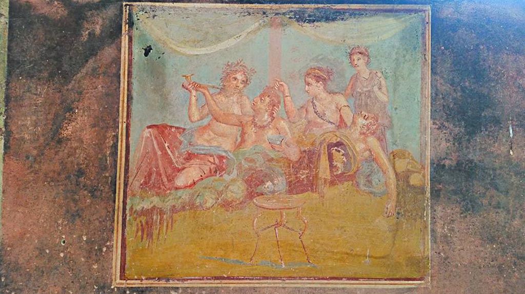 IX.12.6 Pompeii. 2016/2017. 
Room 3, central painting from east wall of triclinium with banqueting scene. Photo courtesy of Giuseppe Ciaramella.
