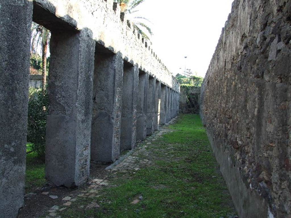 HGW24 Pompeii. December 2006. Looking south along the west portico towards the south-west corner. 
There would have been a turret in both the south-west and north-west corners of the peristyle. 
Both of these turrets would have given a magnificent view of the sea. 
(Fontaine, from near 5,2b, near west wall of garden peristyle).
Nos 9, 10, from the plan by La Vega, would have been found in this level of the west portico.
No.11, from the plan by La Vega, was found just outside the west wall, on the right.
PAH, addendum, p.120 – 121, (See No.9 below, on plan by La Vega).
