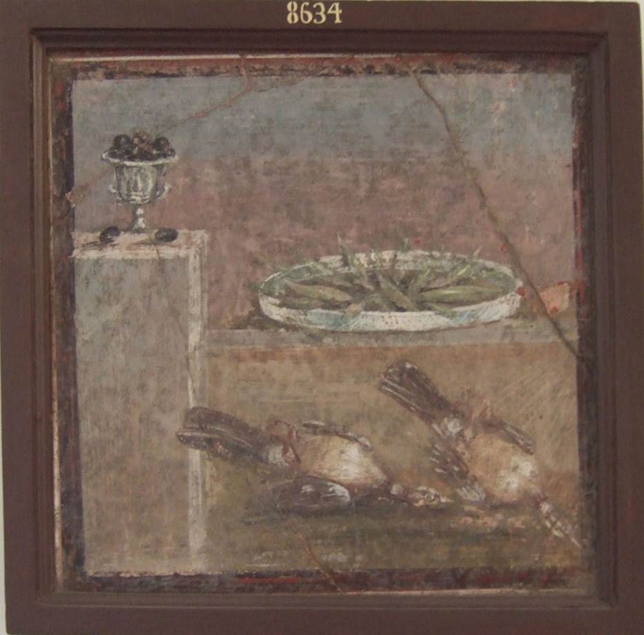HGW24 Pompeii. Found 9th March 1771. Found in either the tablinum or the room at northern end of terrace. (No 3 or no.4 on plan by La Vega).
Wall painting of cup with olives, tray with fish and two partridges.
Now in Naples Archaeological Museum. Inventory number 8634.
See Pagano, M. and Prisciandaro, R., 2006. Studio sulle provenienze degli oggetti rinvenuti negli scavi borbonici del regno di Napoli. Naples: Nicola Longobardi. (p.70).

