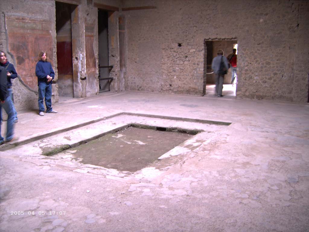 Villa of Mysteries, Pompeii. April 2005. 
Room 64, looking towards south-west corner of atrium, looking with doorways to corridor F1 and room 3 in south wall, on left.
Photo courtesy of Klaus Heese.
