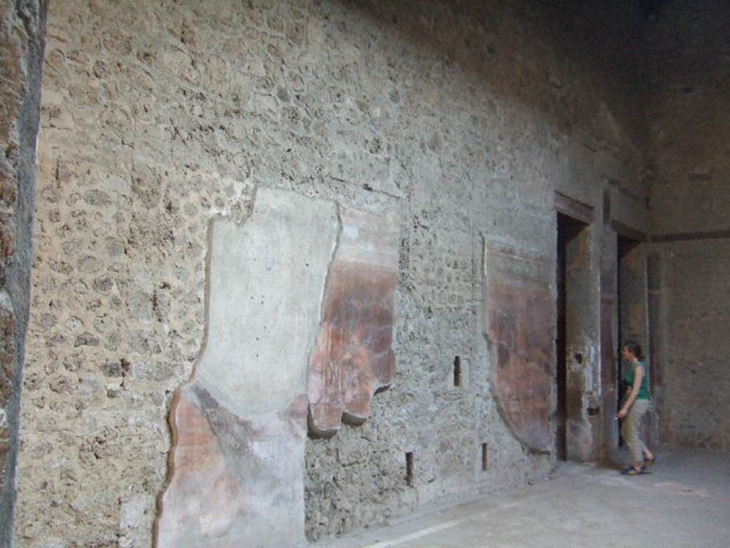 Villa of Mysteries, Pompeii. May 2006. Room 64, south wall with doorway to corridor F1.
For the east wall and east end of room 64, see next part (part 24).

.

