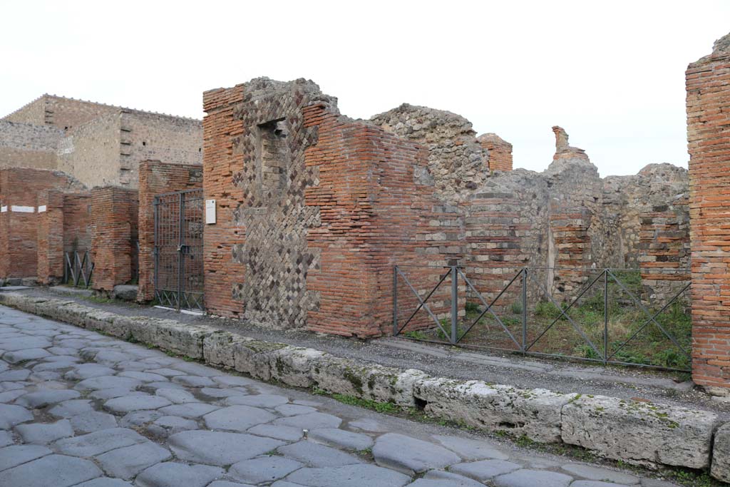 Via Consolare, Pompeii, east side. December 2018. 
Looking north-east to entrances of VI.3.1, VI.3.2, VI.3.3 and VI.3.4, on right. Photo courtesy of Aude Durand.
