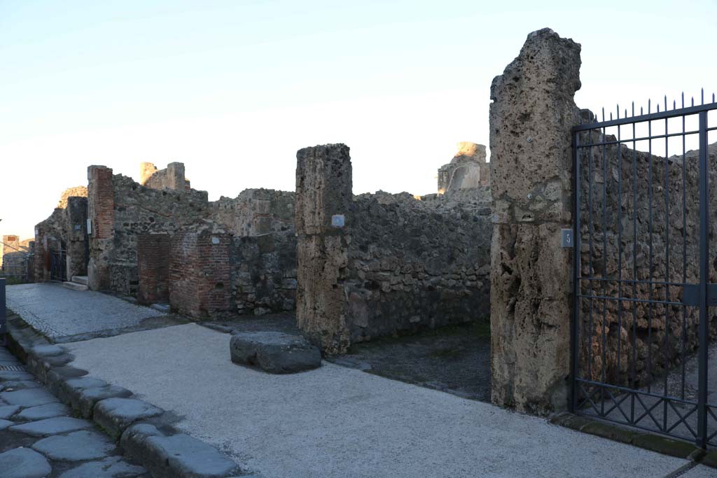 Via Marina, north side, Pompeii. December 2018. 
Looking north-west from VII.7.11, on left, to VII.7.5, on right. Photo courtesy of Aude Durand
