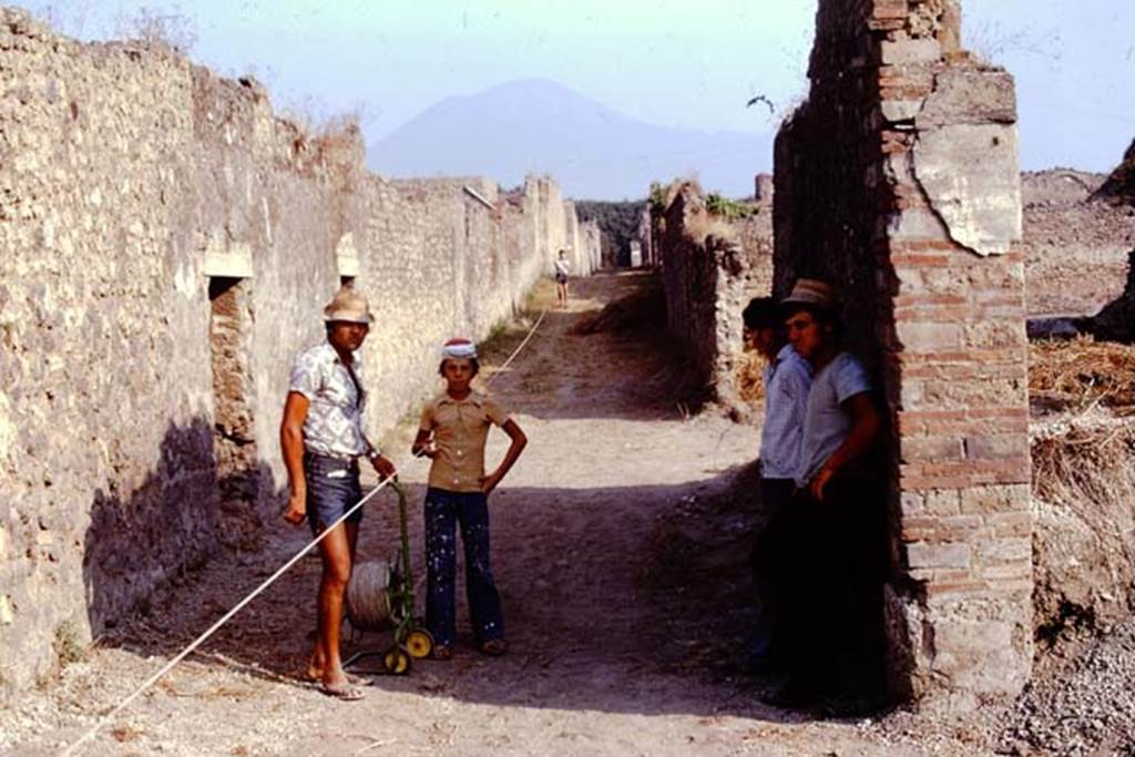 Vicolo dei Fuggiaschi between I.15 and I.14. Pompeii. 1974. Looking north. Photo by Stanley A. Jashemski.   
Source: The Wilhelmina and Stanley A. Jashemski archive in the University of Maryland Library, Special Collections (See collection page) and made available under the Creative Commons Attribution-Non Commercial License v.4. See Licence and use details. J74f0472
