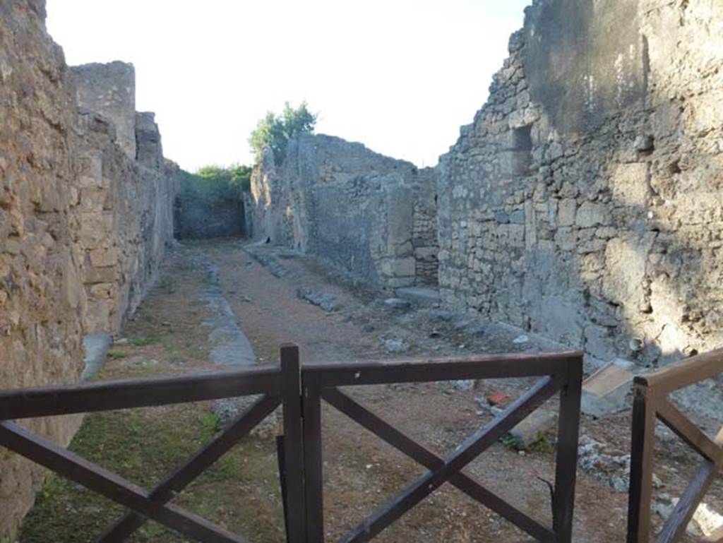Vicolo di Lucrezio Frontone. June 2012. Looking north towards east side of roadway, and doorways at V.4.b and V.4.c. Photo courtesy of Michael Binns. 
