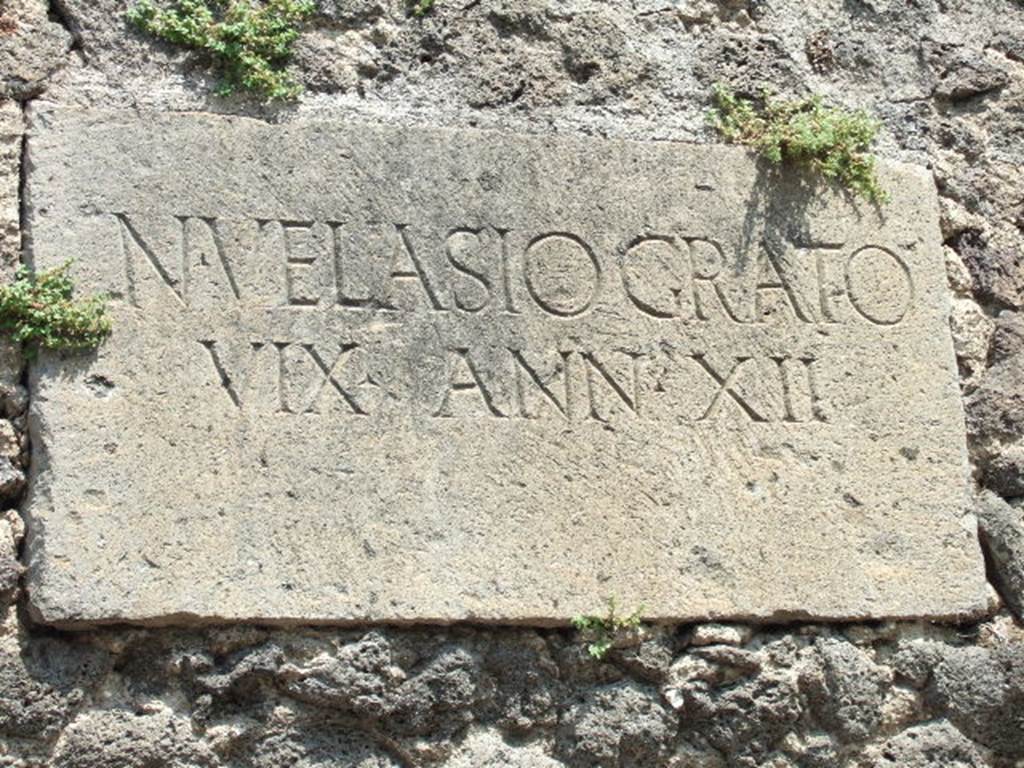 HGE41 Pompeii. May 2006. Tablet with inscription 
N. VELASIO GRATO 
VIX ANN XII.
According to Epigraphik-Datenbank Clauss/Slaby (See www.manfredclauss.de) this reads

N(umerio) Velasio Grato
vix(it) ann(os) XII       [CIL X 1041]

Mau translates this as To the memory of Numerius Velasius Gratus, who lived twelve years. See Mau, A., 1907, translated by Kelsey F. W. Pompeii: Its Life and Art. New York: Macmillan. (p. 425).