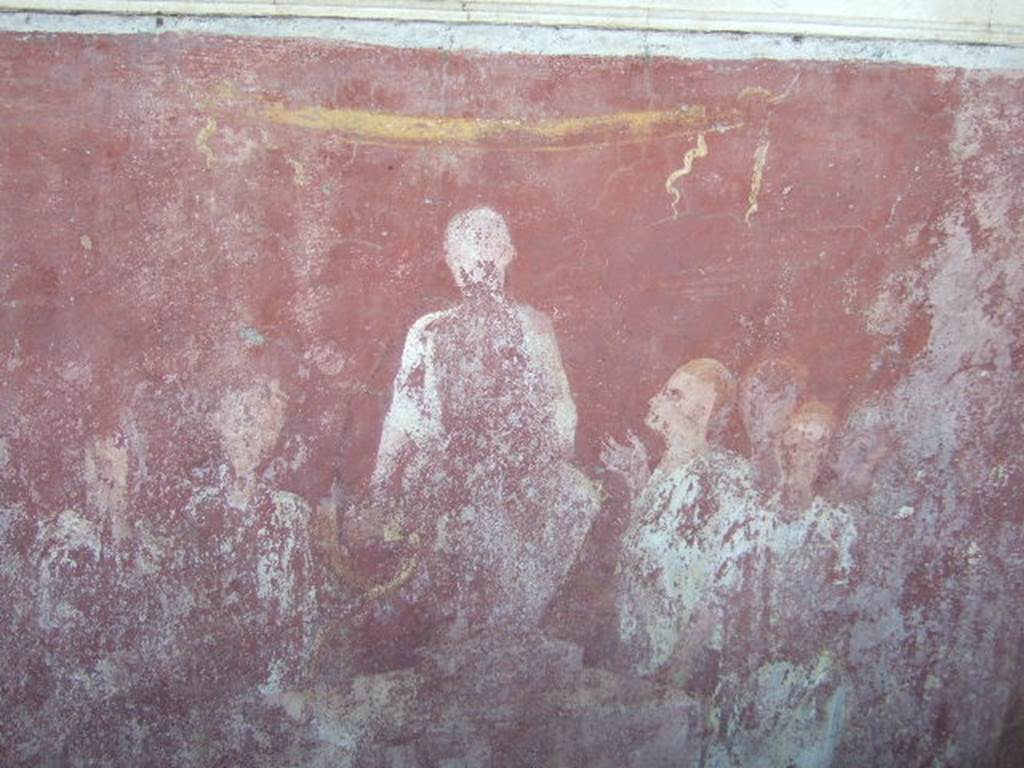 VGJ Pompeii.  May 2006.  Inner tomb east wall.  Painting of seated aedile. Engelmann describes this as the young dignitary (aedilis) in his character of justiciary sitting on a podium;  around him several men, of which the one at his right devoutly looks up at him and lifts his right hand. See Engelmann, W., 1929.  New Guide to Pompeii: Second Edition.  Engelmann. (p. 55).