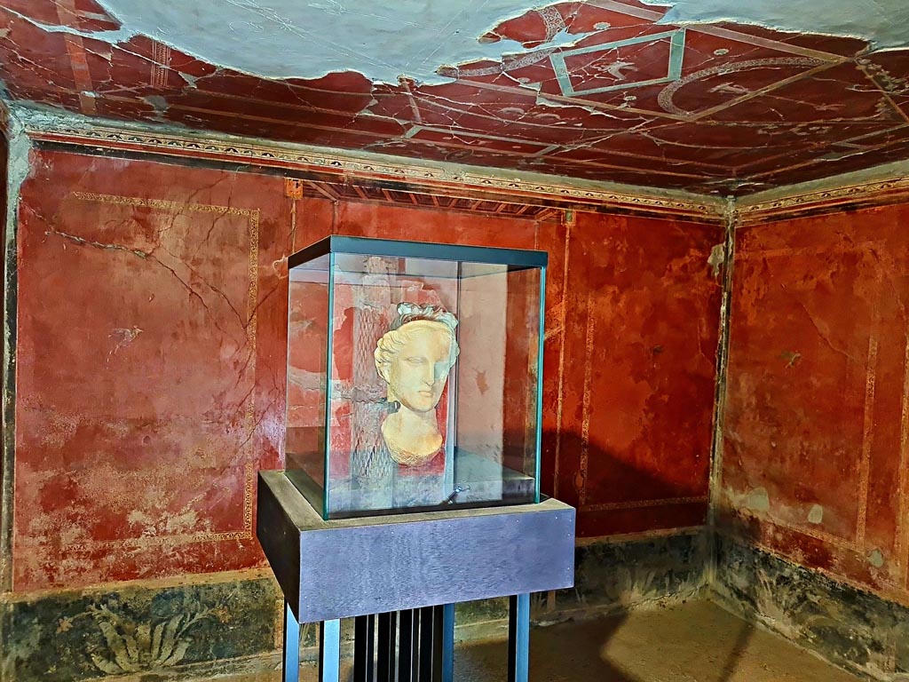 Oplontis Villa of Poppea, October 2023. Room 38, looking towards north wall. Photo courtesy of Giuseppe Ciaramella. 
The white marble head of the goddess Aphrodite on display here in Room 38, was found in the North garden 56. 
