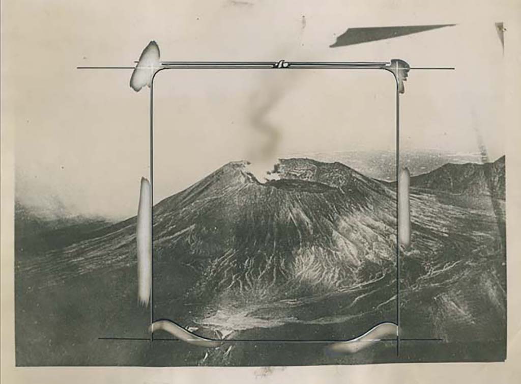 Vesuvius from the air “in one of its slumbering moments”. Press photo dated 10th April 1923 on rear.
Photo courtesy of Rick Bauer.
On the back it says: “An airplane view of Vesuvius. 
This striking view, taken from an airplane, shows Mt. Vesuvius in one of its slumbering moments with just a wisp of steam coming from the crater”.
