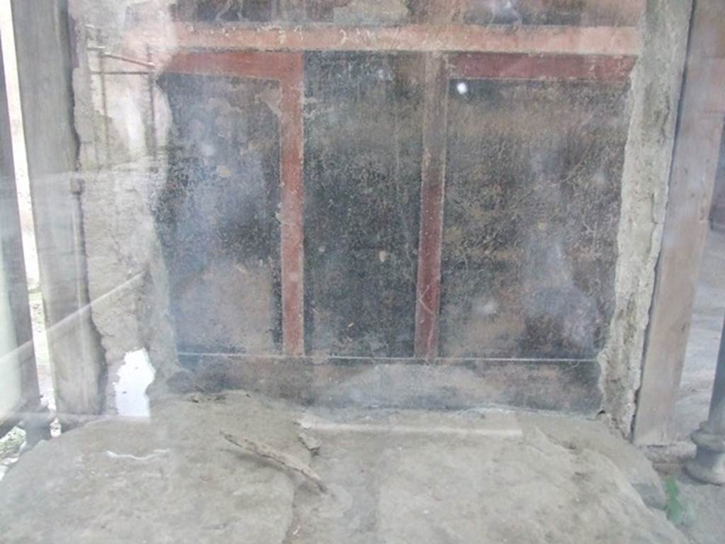 VI.15.1 Pompeii. December 2006.  Looking into glass case on south side of atrium. This contained the remains of an iron and bronze strongbox or safe. This was being restored as at Dec 2006. Painting on rear wall was dated by Mau to be pre 63 AD.  Maiuri did not agree. See Mau, A., 1907, translated by Kelsey F. W. Pompeii: Its Life and Art. New York: Macmillan. (p.327).

