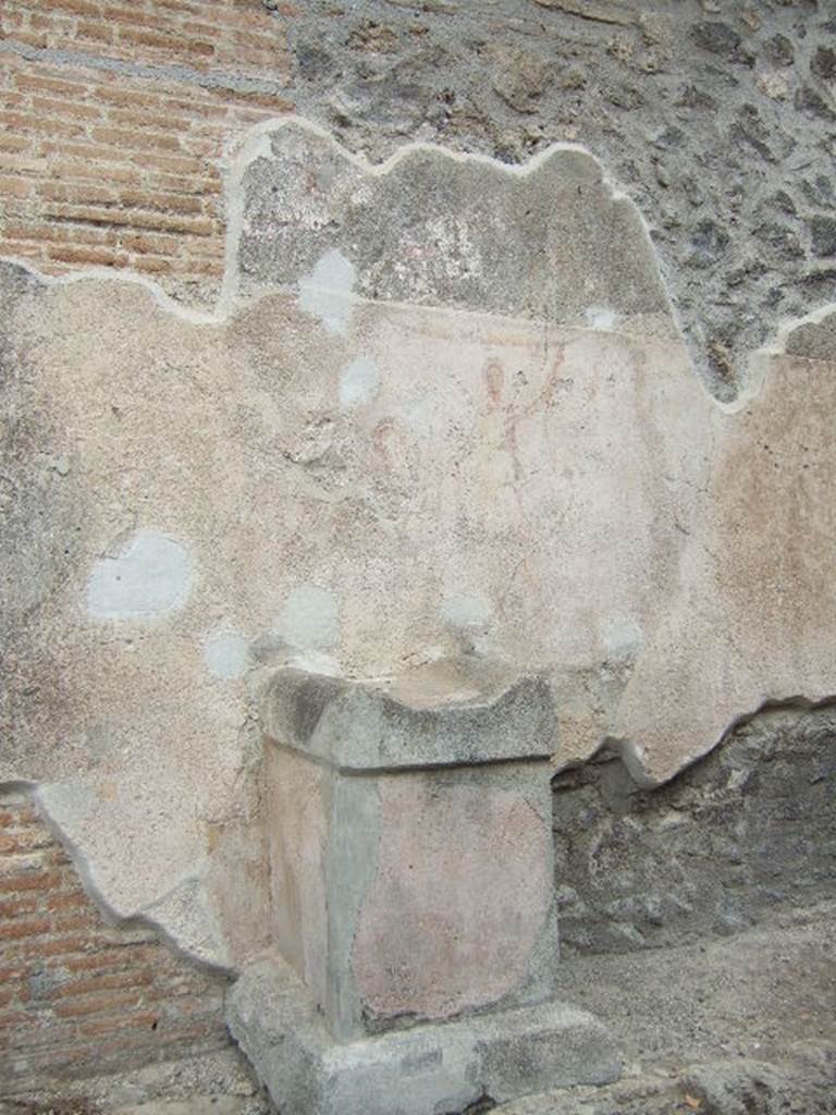 Pompeii, street altar on west side wall of I.11.1, May 2006. Altar with remains of painting above.