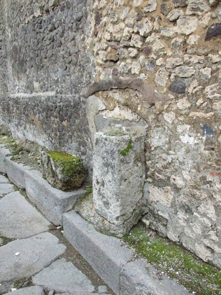 VI.12.6 Pompeii street altar. March 2009. Northern half of street altar is in situ but the southern half is on its side on the higher pavement. 
