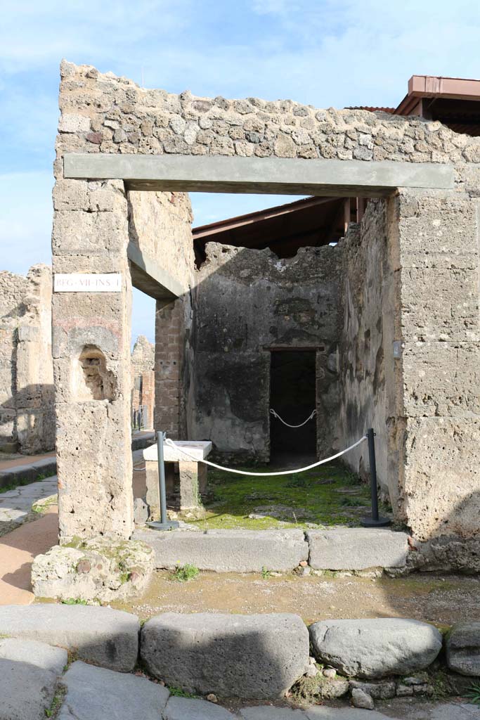VII.1.42, Pompeii. December 2018. 
Looking east to entrance doorway, with niche for street altar, on left. Photo courtesy of Aude Durand.
