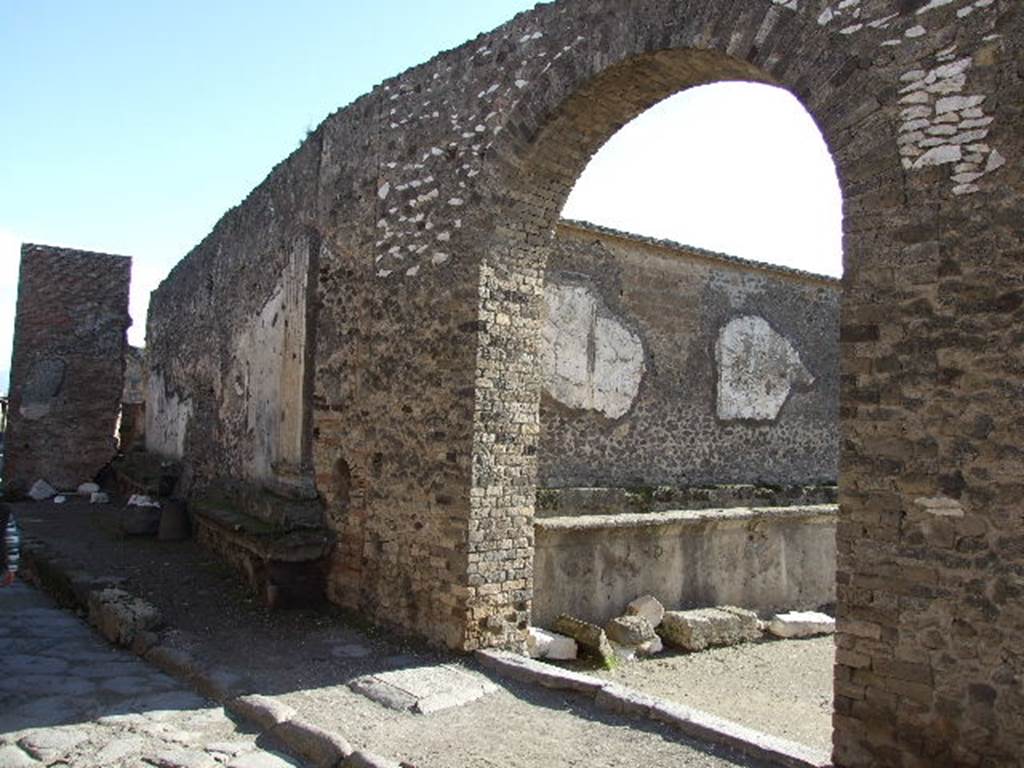 Arch leading to Forum with niche on left of entrance.