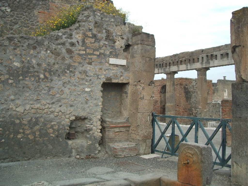 Outside VIII.2.11 Pompeii. Street altar at corner of Via delle Scuole and the Forum.