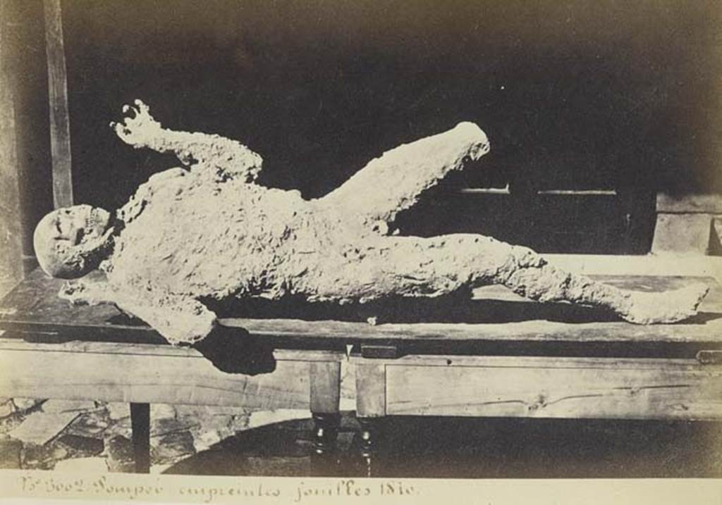 VII.2.16 Pompeii. Undated photograph by Amodio, numbered 3002, from an album dated c.1873. One of the seven skeletons found in the house on 12th March 1868.
Photo courtesy of Rick Bauer.
