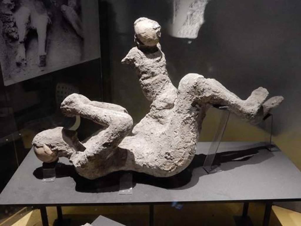 VI.17.42, Pompeii, May 2018. Plaster cast of a woman (52) and child (51) found in the corridor leading to the garden area.
Photo courtesy of Buzz Ferebee.
According to Estelle Lazer, this individual (52) is clearly a mature adult, but there is insufficient evidence to make an attribution of the sex of this victim.
See Lazer E., et al. 2020. Inside the Casts of the Pompeian Victims: Results from the First Season of the Pompeii Cast Project In 2015. Papers of the British School at Rome.
