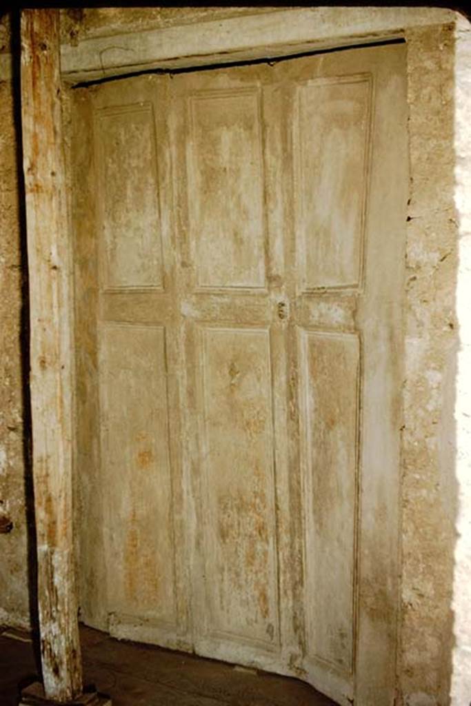 Villa of Mysteries, Pompeii. 1957. Room 16, cubiculum. Doorway with plaster cast of shutters at south end of portico P5. Photo by Stanley A. Jashemski.
Source: The Wilhelmina and Stanley A. Jashemski archive in the University of Maryland Library, Special Collections (See collection page) and made available under the Creative Commons Attribution-Non Commercial License v.4. See Licence and use details.
J57f0387
