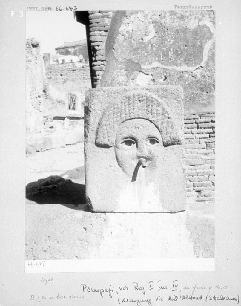 Fountain outside I.4.15 on Via Stabiana. Pre-1943. Looking north-east across crossroads of Holconius. 
Photo by Tatiana Warscher.
See Warscher, T. Codex Topographicus Pompeianus, IX.1. (1943), Swedish Institute, Rome. (no.65).
