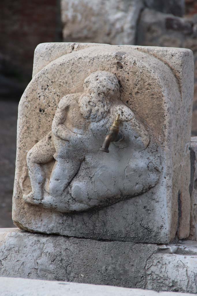 Fountain outside VI.14.17, Pompeii. September 2017. Detail of marble relief of Silenus on pilaster of fountain.
Photo courtesy of Klaus Heese.
