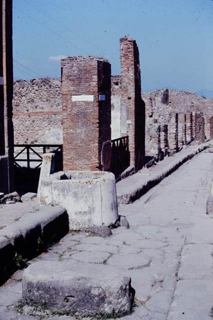 Fountain outside VII.4.32, Pompeii. 1968. Looking south-east along Via degli Augustali. 
Note that the modern tap block front is not present at the rear.
Photo by Stanley A. Jashemski.
Source: The Wilhelmina and Stanley A. Jashemski archive in the University of Maryland Library, Special Collections (See collection page) and made available under the Creative Commons Attribution-Non Commercial License v.4. See Licence and use details.
J68f1645
