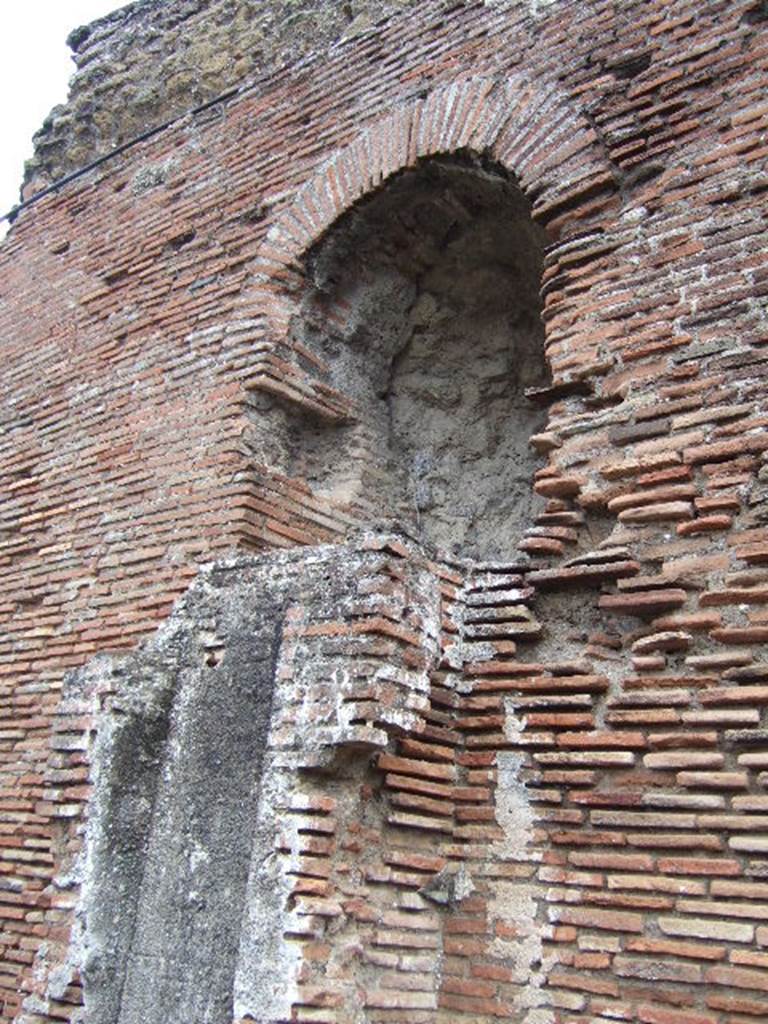VII.5.8 Pompeii.  Side wall with remains of water tower. 