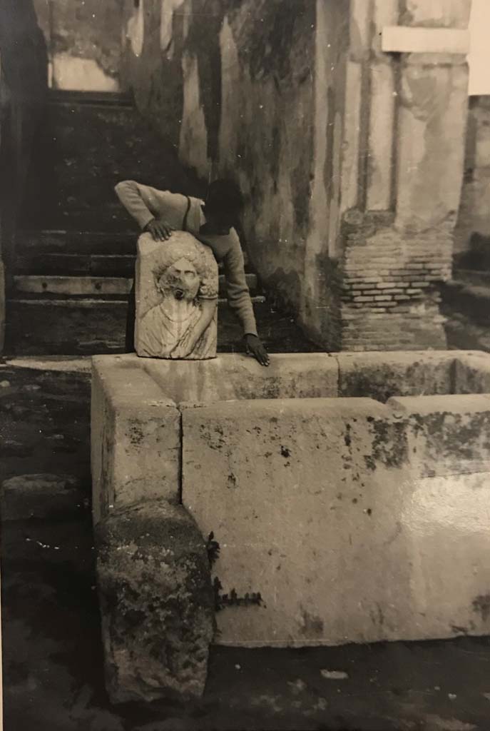 VII.9.67 Pompeii, 5th June 1925. 
Looking north on Via dell’Abbondanza towards fountain and rear steps at VII.9.67. Photo courtesy of Rick Bauer.

