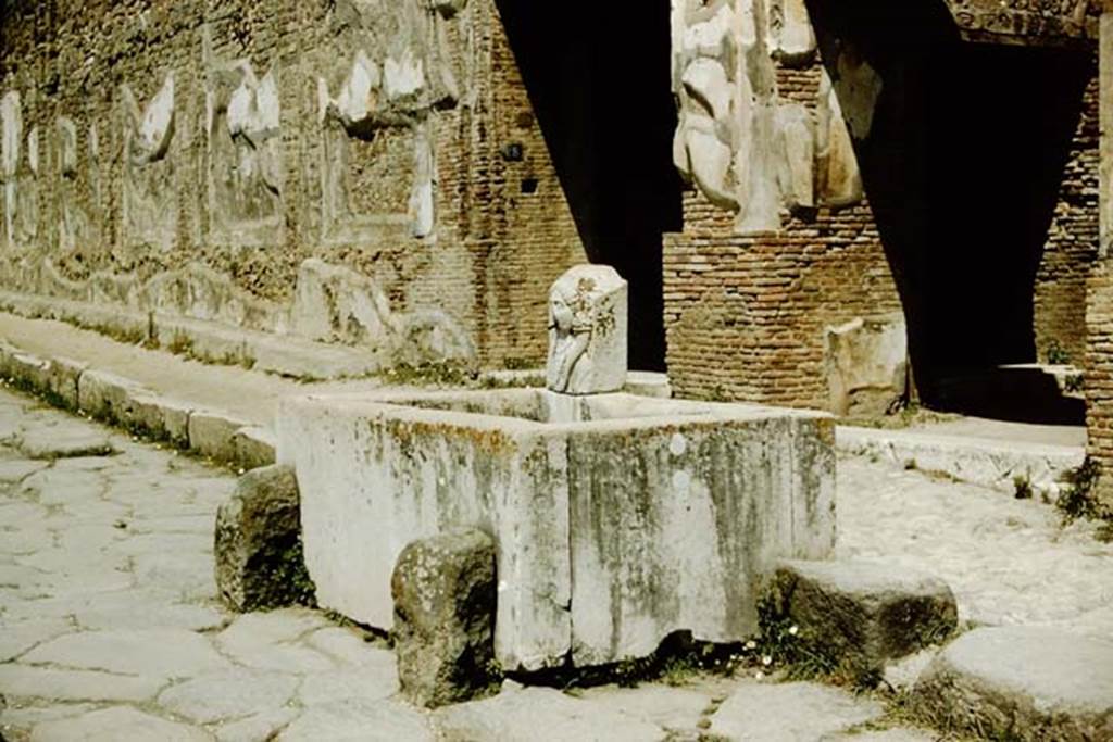 Via dell’Abbondanza, Pompeii. 1957. Looking west along north side, towards fountain outside VII.9.67/68.  Photo by Stanley A. Jashemski.
Source: The Wilhelmina and Stanley A. Jashemski archive in the University of Maryland Library, Special Collections (See collection page) and made available under the Creative Commons Attribution-Non Commercial License v.4. See Licence and use details.
J57f0156
