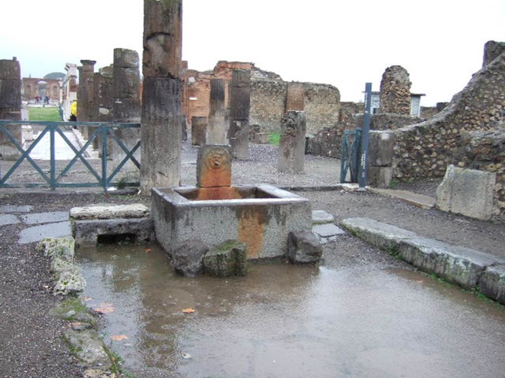 Outside VIII.2.11, Pompeii. December 2005. Fountain pilaster with relief of head of gorgon.
