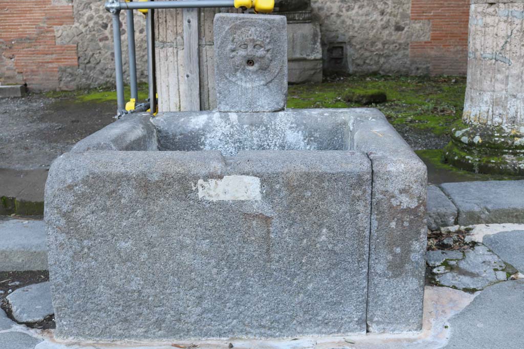 Fountain outside VIII.7.30 on Via del Tempio d’Iside. December 2018. Looking south. Photo courtesy of Aude Durand.


