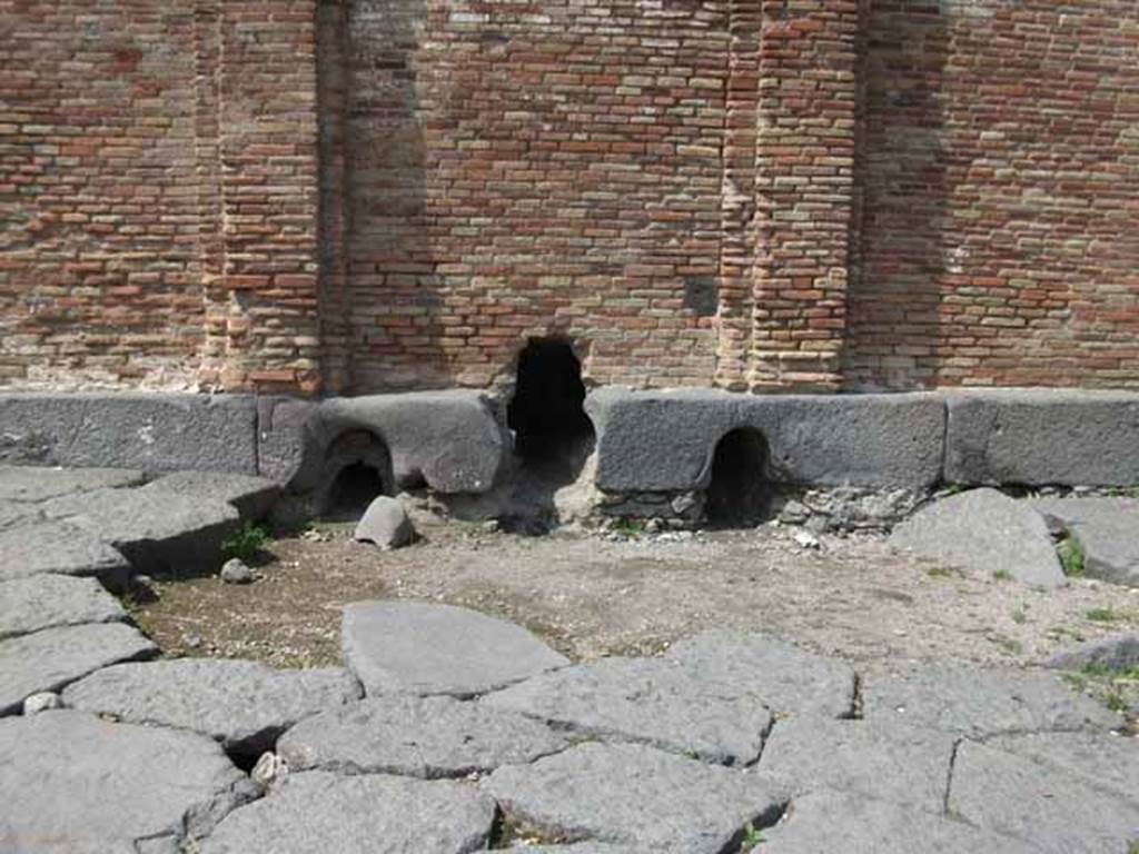 Castellum Acquae Pompeii. May 2010. Three outlets "h" for pipes from water tower. Inside is a cistern which distributed water through three outlets which served different areas of the town. 