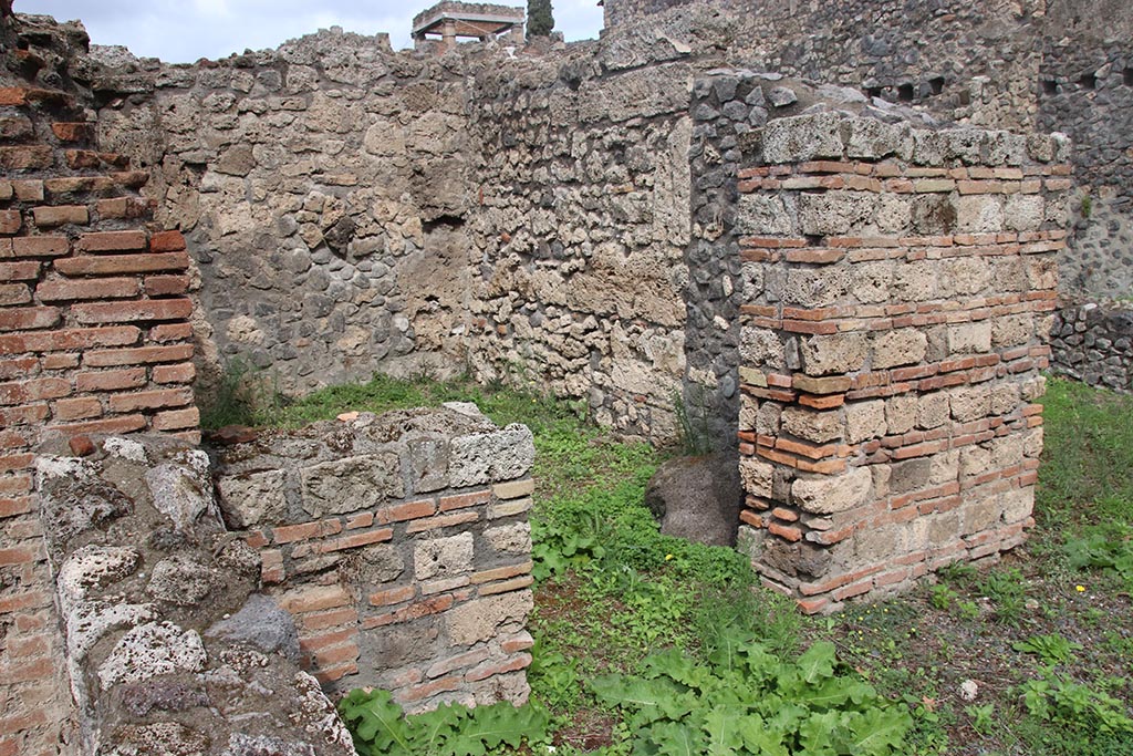 I.1.3 Pompeii, October 2024. Looking north-east through doorway into room “e”. Photo courtesy of Klaus Heese.