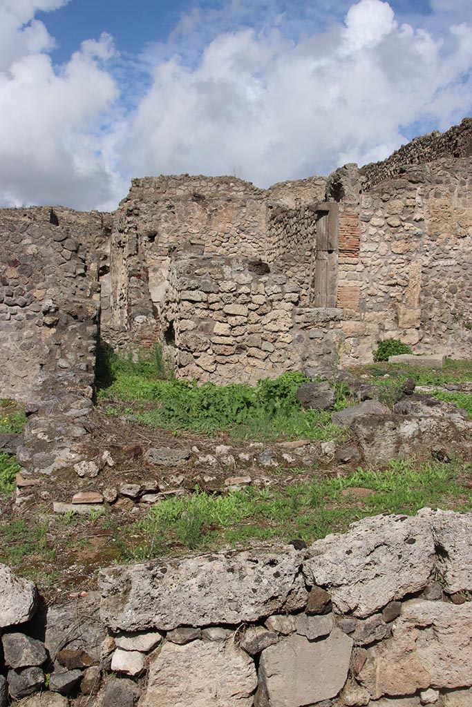 I.2.3 Pompeii. October 2024. 
Looking north across remains of kitchen, towards north wall and stairs. Photo courtesy of Klaus Heese.
