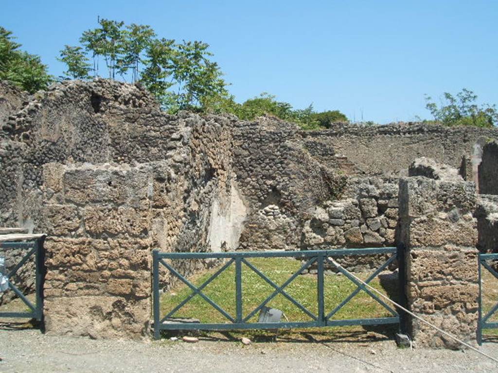 I.2.7 Pompeii. May 2005. Shop entrance in centre of picture.